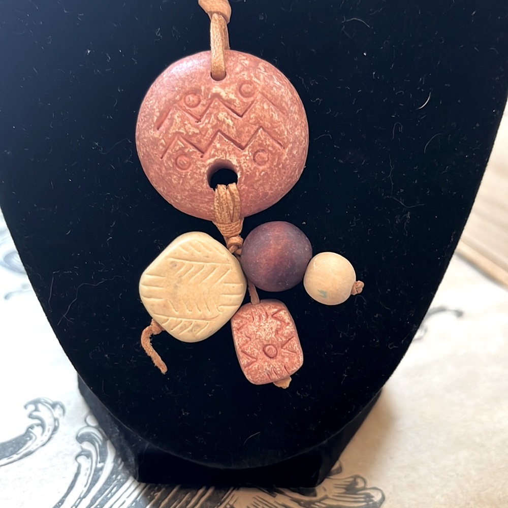 15 inch leather necklace with tribal looking beads.